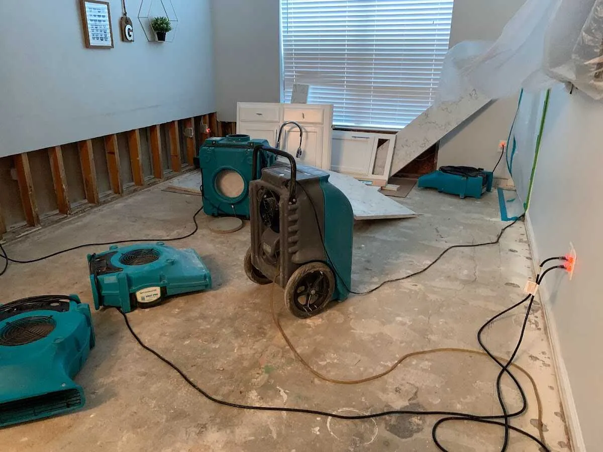 Dehumidifier in flood-cut room for Water Damage Restoration in Central